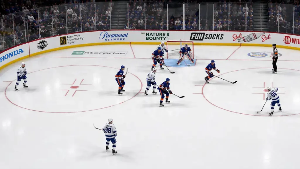An overhead view of an NHL power play situation, with hockey players positioned in the offensive zone near the goal crease.